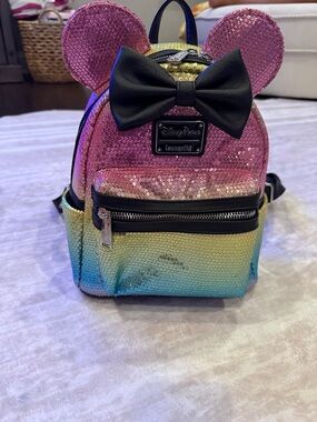 Loungefly Rainbow Sequin Mini Backpack with Black Bow